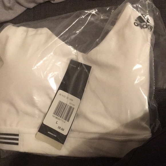 adidas Accessories - Adidas large girls white sports bra. This has never been opened. New with tags